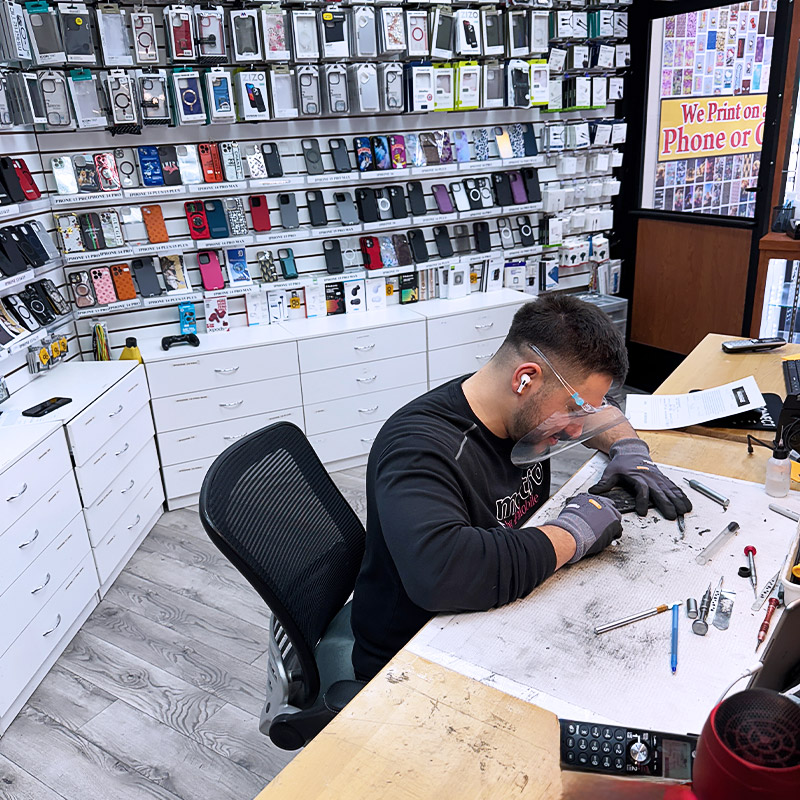 a person sitting at a table in a library