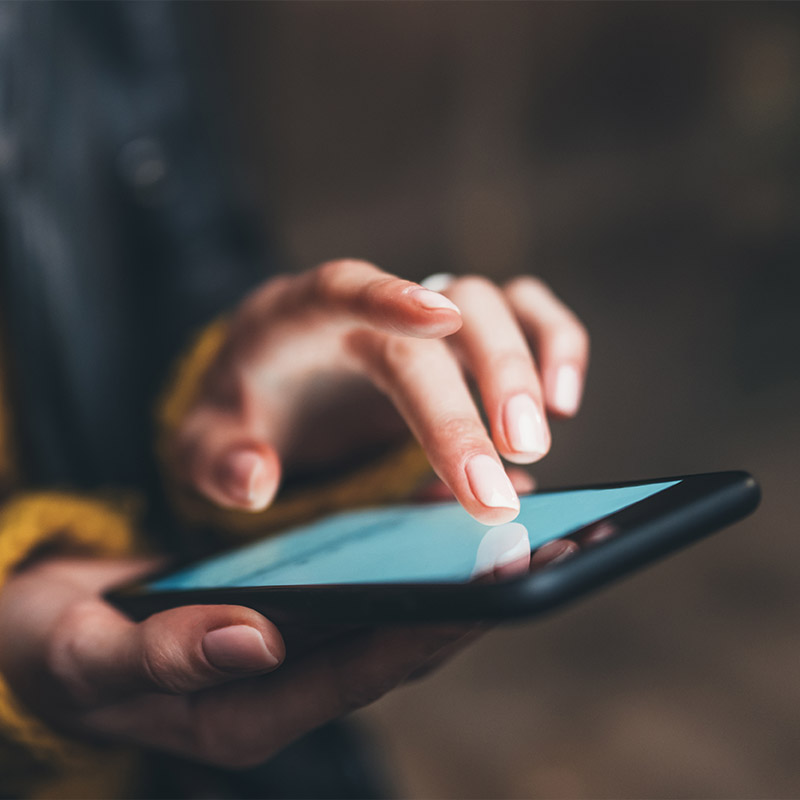 a hand holding a cell phone